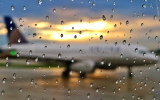 view from window of plane in rain