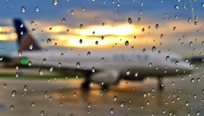 view from window of plane in rain